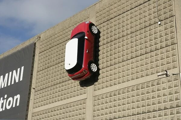Mini. A Mini on the wall outside the BMW car factory at Swindon Wiltshire