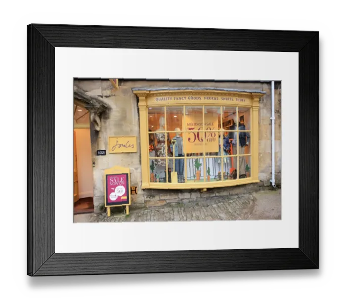Framed Print : Burford. A shop window in the High Street at Burford Oxon