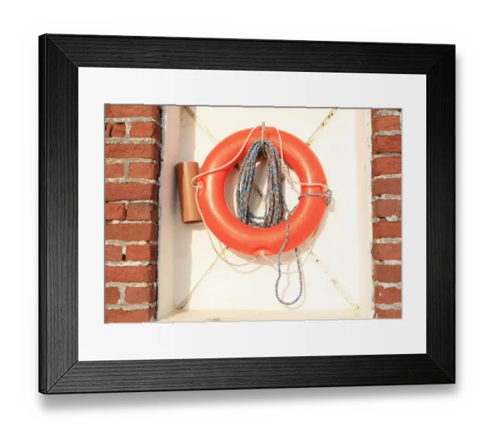 Framed Print : Life belt on the Quayside in the Cornish fishing port of Charlestown on the south coast Framed Print : Life belt on the Quayside in the Cornish fishing port of Charlestown on the south coast