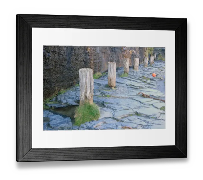 Framed Print : Boscastle. A row of bollards on the quayside around the harbour in the Framed Print : Boscastle. A row of bollards on the quayside around the harbour in the