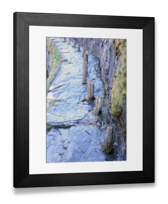 Framed Print : Boscastle. A row of bollards on the quayside around the harbour in the Framed Print : Boscastle. A row of bollards on the quayside around the harbour in the