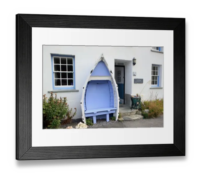Framed Print : Boscastle. An old boat used as a seat outside a cottage in the North Cornish Framed Print : Boscastle. An old boat used as a seat outside a cottage in the North Cornish