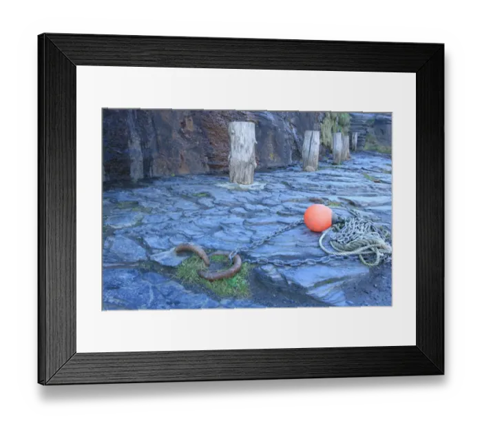 Framed Print : Boscastle. A row of bollards on the quayside around the harbour in the Framed Print : Boscastle. A row of bollards on the quayside around the harbour in the