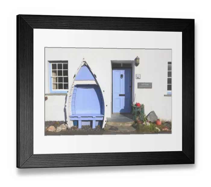 Framed Print : Boat Seat. A seat made from an old boat outside a cottage in the cornish Framed Print : Boat Seat. A seat made from an old boat outside a cottage in the cornish