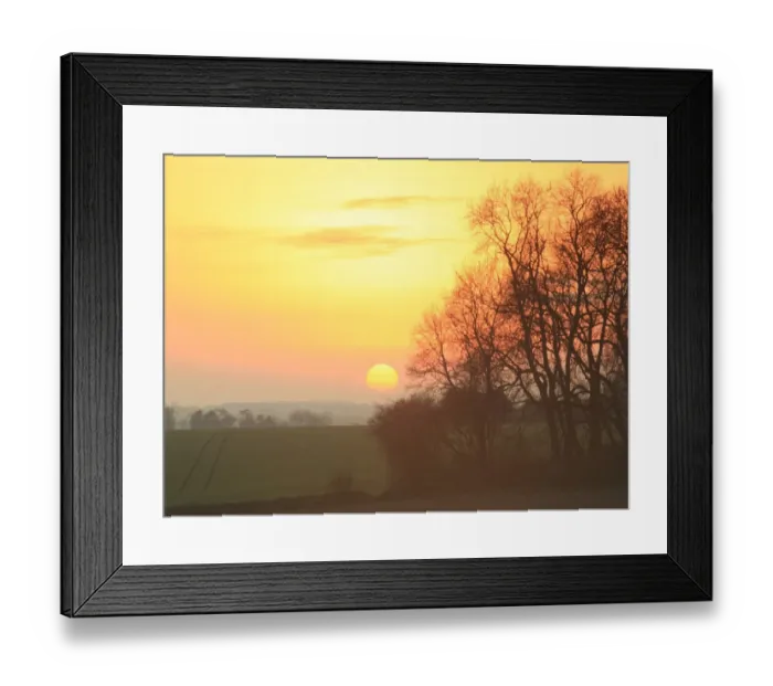 Framed Print : Sunset. A pale winters sunsets over a valley near Yanworth on a cold Febuary afternoon Framed Print : Sunset. A pale winters sunsets over a valley near Yanworth on a cold Febuary afternoon