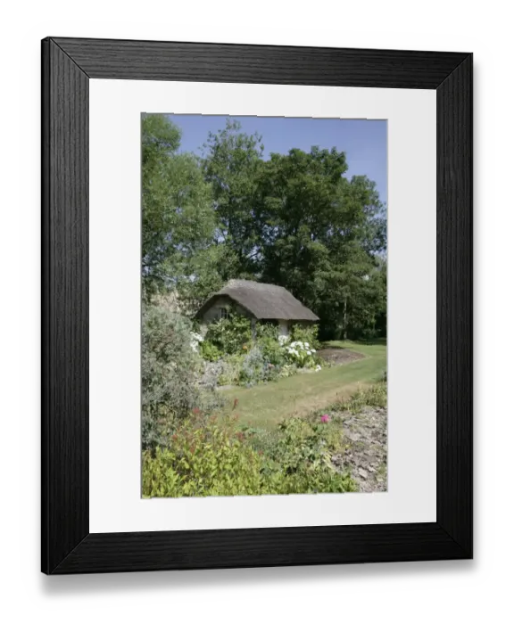 Framed Print : Winson. A thatch cottage in a cotswold garden in the hamlet of Winson nr Bibury Framed Print : Winson. A thatch cottage in a cotswold garden in the hamlet of Winson nr Bibury