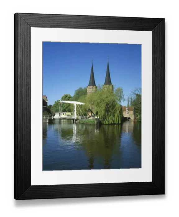 Framed Print : Delft. The Oostpoort with its twin towers and bridge over the canal at Delft in Holland Framed Print : Delft. The Oostpoort with its twin towers and bridge over the canal at Delft in Holland