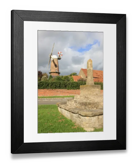 Framed Print : Quainton. The 15th-century stone cross and Windmill built 1830 in the Buckinghamshire Framed Print : Quainton. The 15th-century stone cross and Windmill built 1830 in the Buckinghamshire