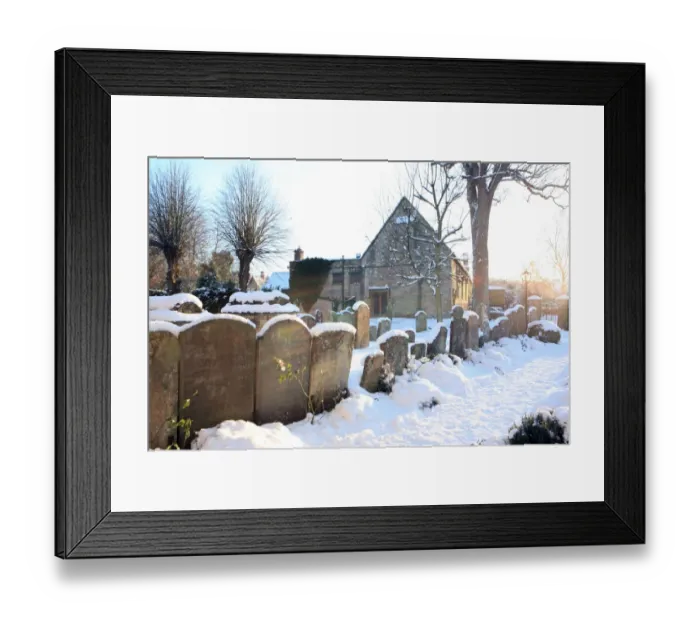 Framed Print : Burford. The church yard covered in snow on cold winters day at the cotswold Framed Print : Burford. The church yard covered in snow on cold winters day at the cotswold