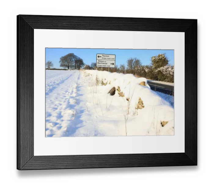 Framed Print : Burford. A road covered in snow on cold winters day near the cotswold town Framed Print : Burford. A road covered in snow on cold winters day near the cotswold town