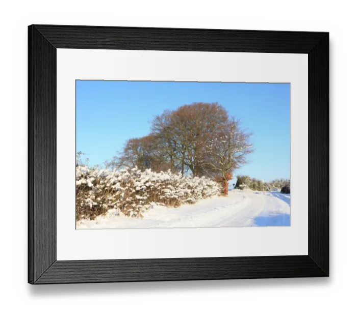 Framed Print : Burford. A rooad covered in snow on cold winters day near the cotswold Framed Print : Burford. A rooad covered in snow on cold winters day near the cotswold