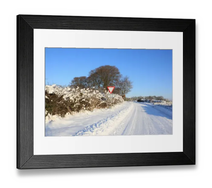 Framed Print : Burford. A road covered in snow on cold winters day near the cotswold town Framed Print : Burford. A road covered in snow on cold winters day near the cotswold town