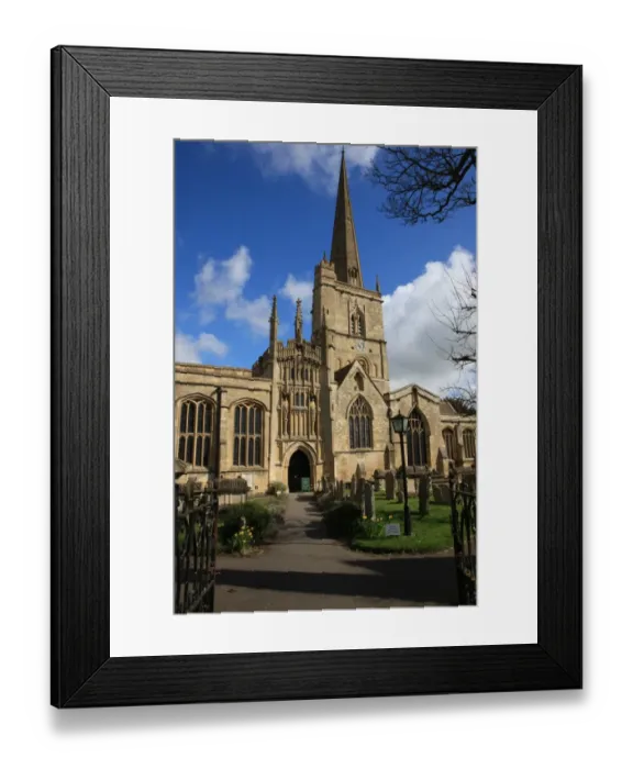 Framed Print : Burford. The Church yard at Burford Oxfordshire on a summers morning Framed Print : Burford. The Church yard at Burford Oxfordshire on a summers morning