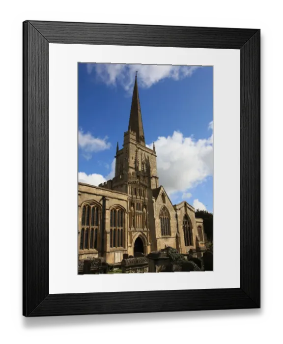 Framed Print : Burford. The Church yard at Burford Oxfordshire on a summers morning Framed Print : Burford. The Church yard at Burford Oxfordshire on a summers morning