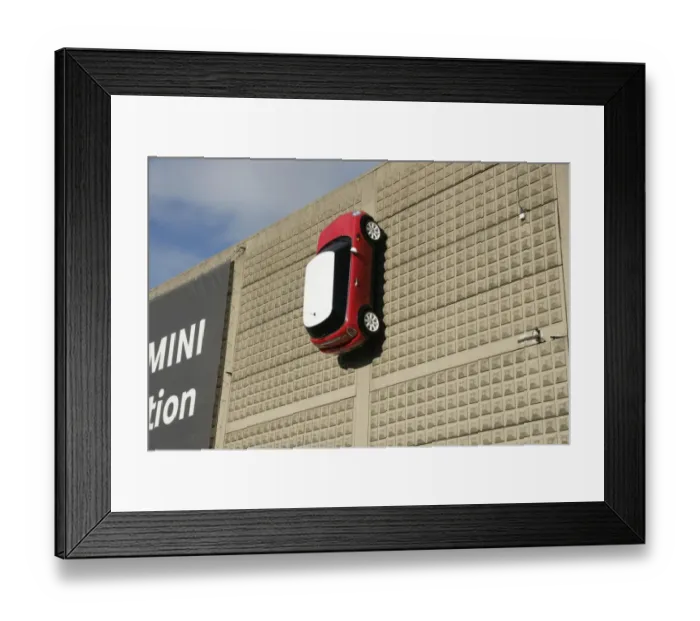 Framed Print : Mini. A Mini on the wall outside the BMW car factory at Swindon Wiltshire Framed Print : Mini. A Mini on the wall outside the BMW car factory at Swindon Wiltshire
