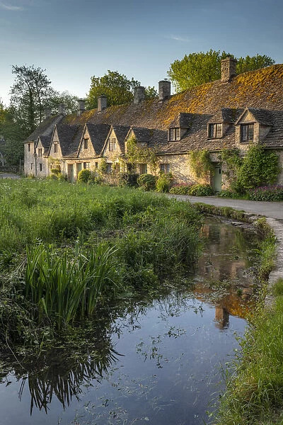 Early Spring morning view of the beautiful Cotswolds cottages at Arlington Row in Bibury