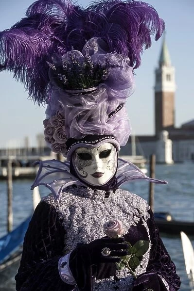 Lady in black and purple mask and feathered hat, Venice Carnival, Venice, UNESCO