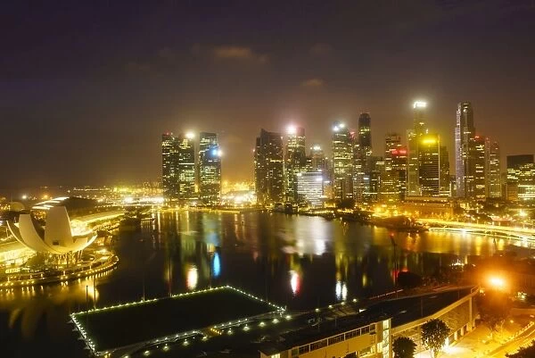 The towers of the Central Business District and Marina Bay by night, Singapore, Southeast Asia