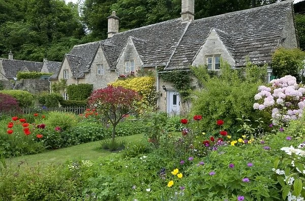 Cottage gardens, Bibury, Cotswolds, Gloucestershire, England, June