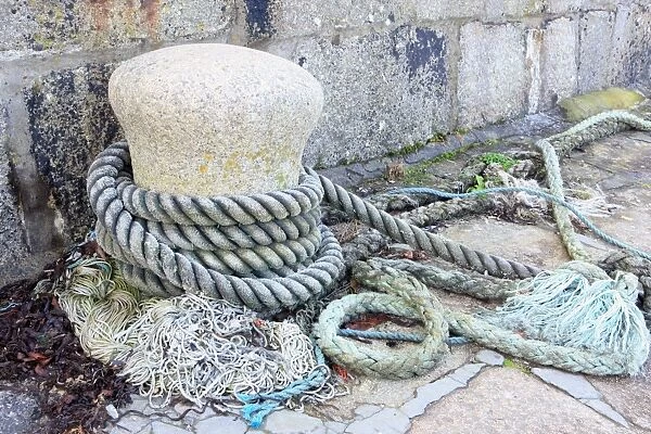 Bollard. A Bollard and ships ropes on the Quayside in the Cornish fishing