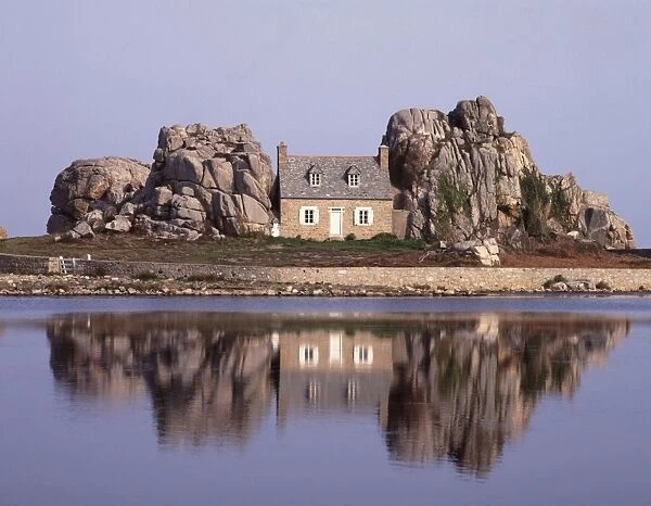 Brittany. The House between the Rock on the Brittany Coast in Northern France