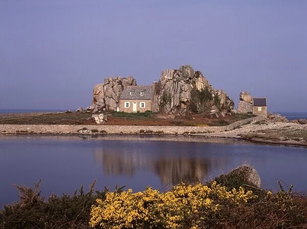 Brittany. The House between the Rock on the Brittany Coast in Northern France
