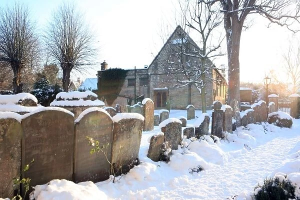 Burford. The church yard covered in snow on cold winters day at the cotswold