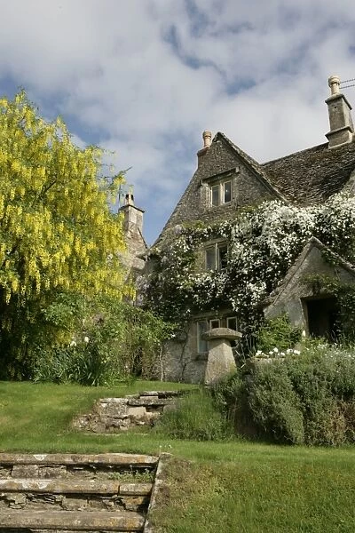 Calmsden. A spring day in the cotswold village of Calmsden with its old farm house