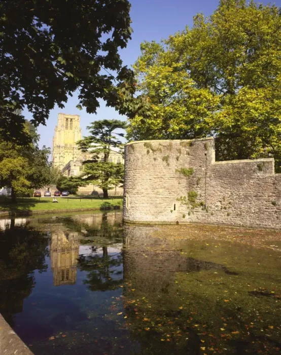 Framed Print : Wells. The Cathedral reflected in the moat around the Bishops Palace at Wells in Somerset Framed Print : Wells. The Cathedral reflected in the moat around the Bishops Palace at Wells in Somerset