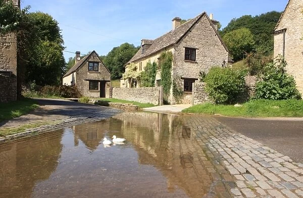 The Cotswolds. The reflection of the stone cottages