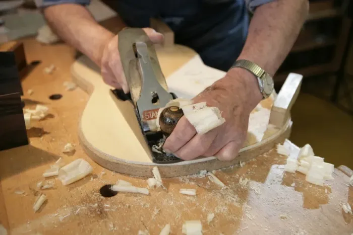 Framed Print : Guitar Maker