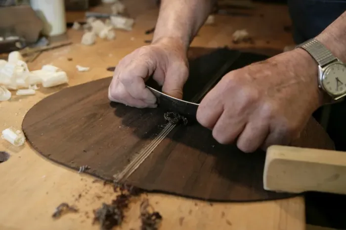 Framed Print : Guitar Maker