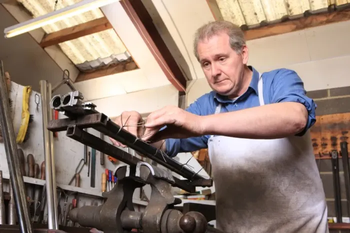 Framed Print : Gunsmith Graham Ball working at John Fosters Carlton near Stockton on Tee
