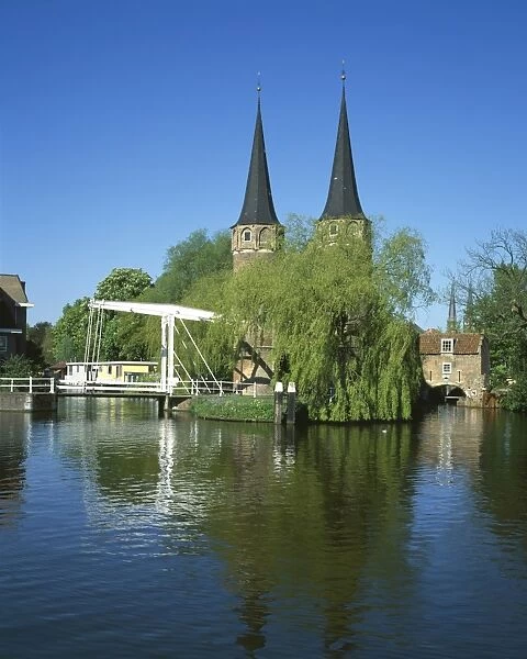 Delft. The Oostpoort with its twin towers and bridge over the canal at Delft in Holland