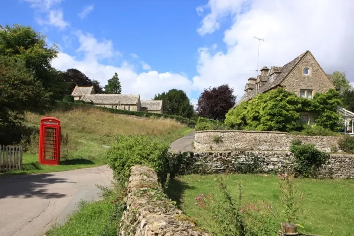 Framed Print : Phone Box. Duntisbourne Abbots Glos Cotswolds Summer. Village church Phonet box