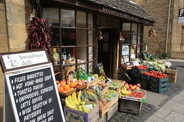 Shop Sign. Fresh vegetables on display outside a shop in the Cotswold village of Broadway