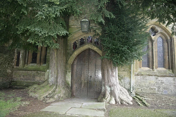 Stow on the Wold. The North Door Way with its Yew trees at church in the