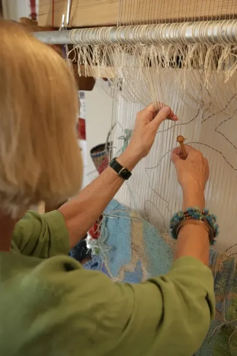 Framed Print : Tapestry. Kirsten Glasbrook working on a Tapestry Framed Print : Tapestry. Kirsten Glasbrook working on a Tapestry