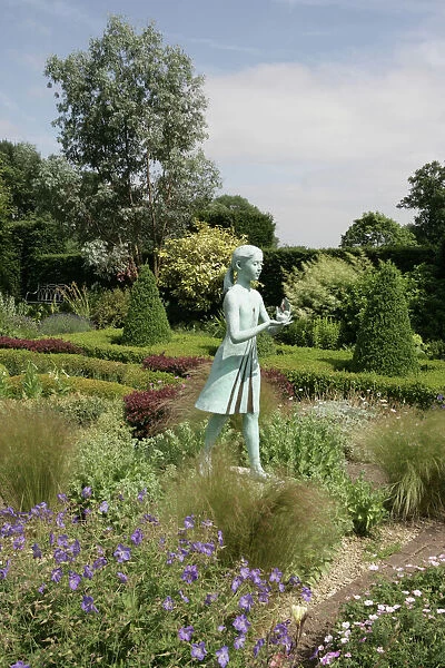 Waterperry Gardens. A statue in the Herbaceous Border at Waterperry near Oxford