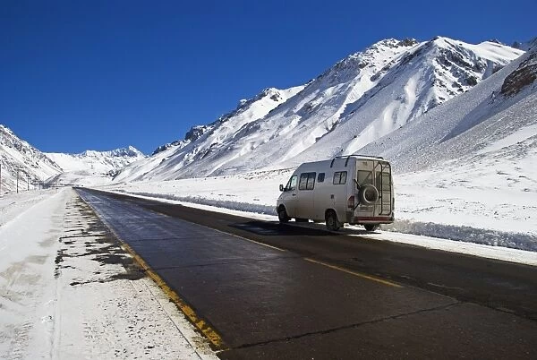 a camper van on the side of a road in parque provincial aconcagua in winter