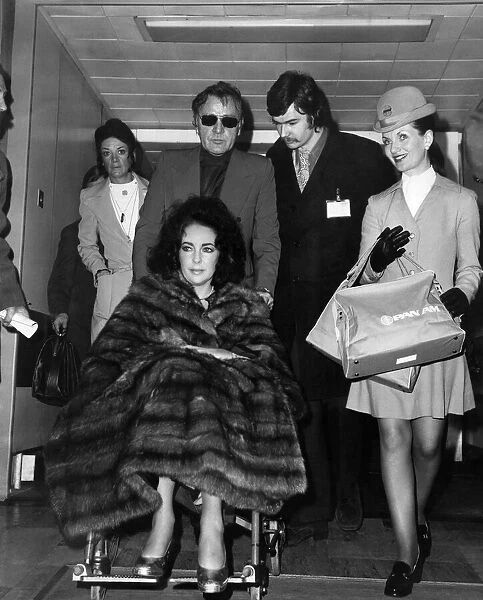 Liz Taylor and Richard Burton at Heathrow Airport today. December 1973