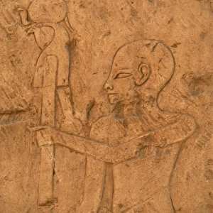 EGYPTIAN ART. Relief depicting a priest carrying the image o