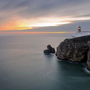 Dusk lights up the lighthouse overlooking the Atlantic Ocean, Cabo De Sao Vicente