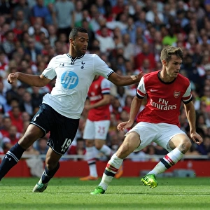 Arsenal's Aaron Ramsey Fends Off Tottenham's Mousa Dembele in Intense Premier League Clash