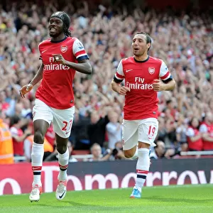 Arsenal's Dominant Performance: Gervinho and Cazorla Celebrate Arsenal's First Goal in 6-1 Victory over Southampton