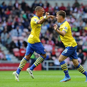 Arsenal's Unstoppable Duo: Ramsey and Gibbs Celebrate Goals Against Sunderland (2013-14)