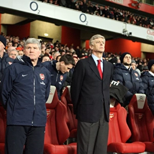 Arsene Wenger the Arsenal Manager and Pat Rice his Assistant satnd for a minutes silence following the disater in Haiti. Arsenal 4: 2 Bolton Wanderers. Barclays Premier League. Emirates Stadium, 20 / 1 / 10. Credit : Arsenal Football Club