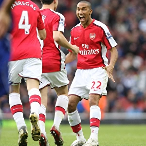 Gael Clichy celebrates the 1st Arsenal goal with scorer Samir Nasri