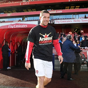Lukas Podolski (Arsenal) in his Arsenal for Everyone T Shirt. Arsenal 4: 1 Sunderland