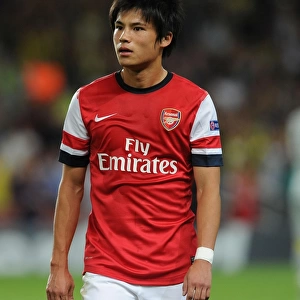 Ryo Miyaichi: Arsenal's Determined Striker in UEFA Champions League Clash Against Fenerbahce (2013-14)